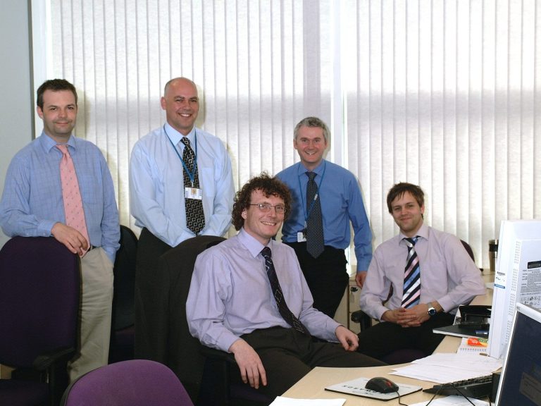 Executive Management Team Photo Five men in an office. A management team. Management photograph.